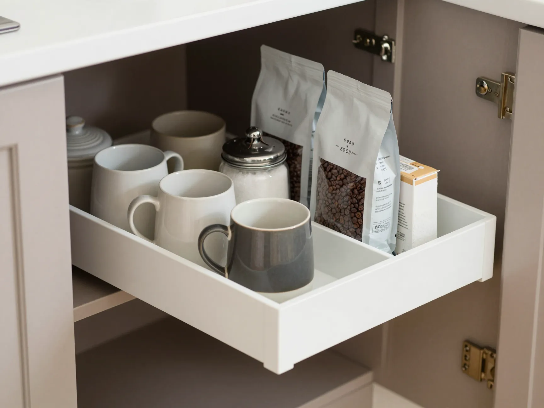 Pull out shelf tray with coffee supplies in deep cabinet