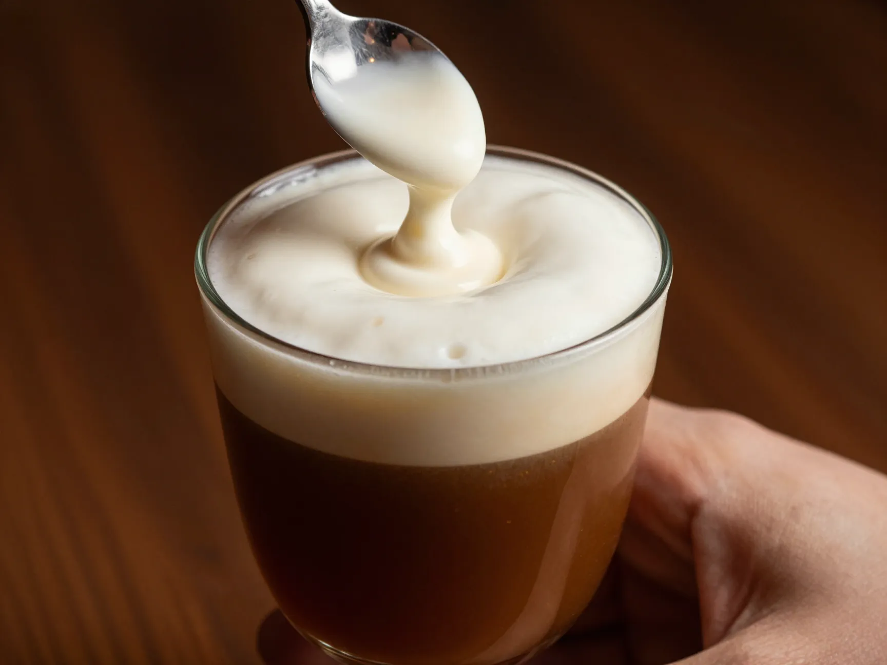 Irish coffee glass with whiskey and cream float
