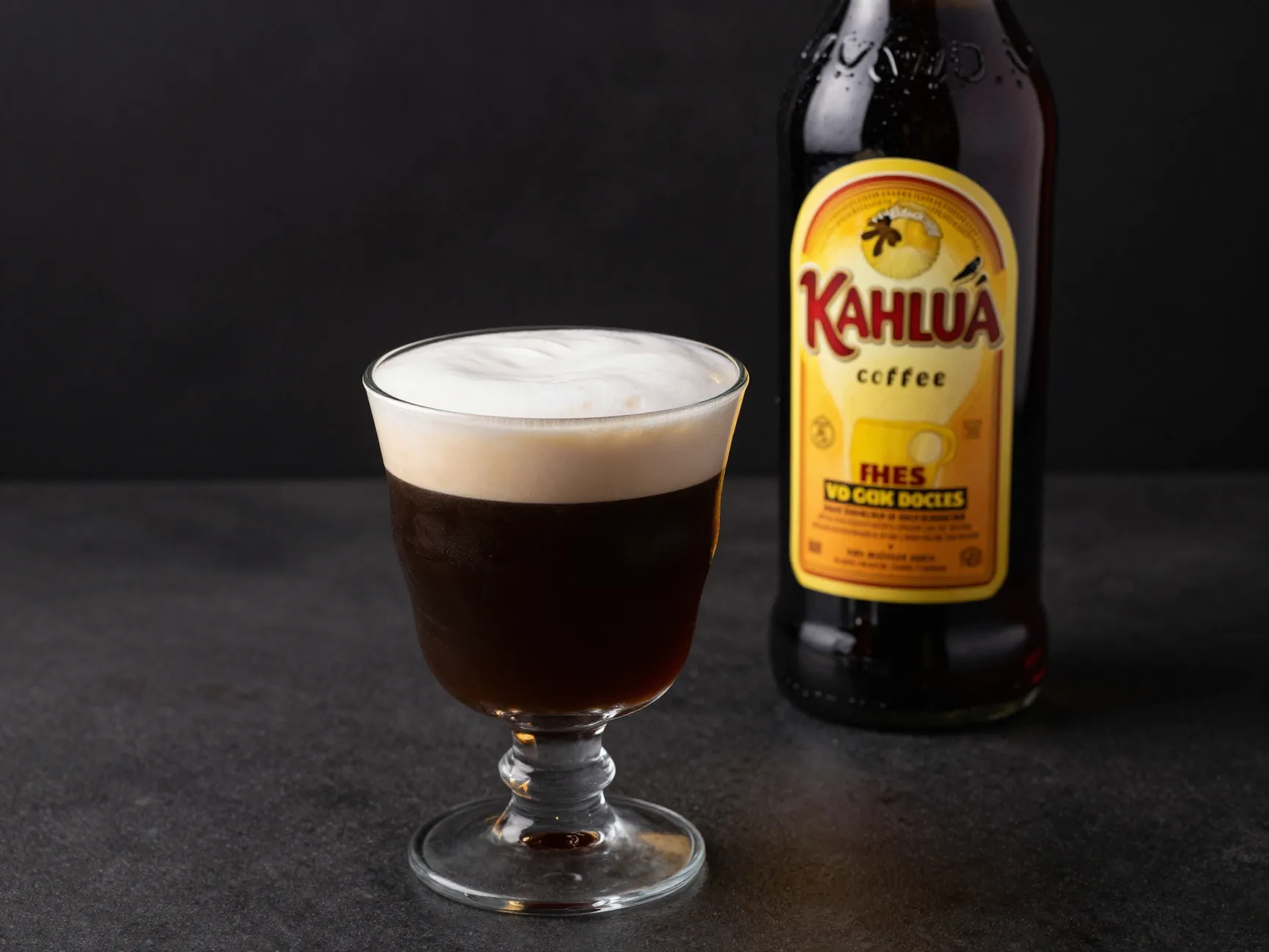Kahlua irish coffee with coffee liqueur bottle on bar