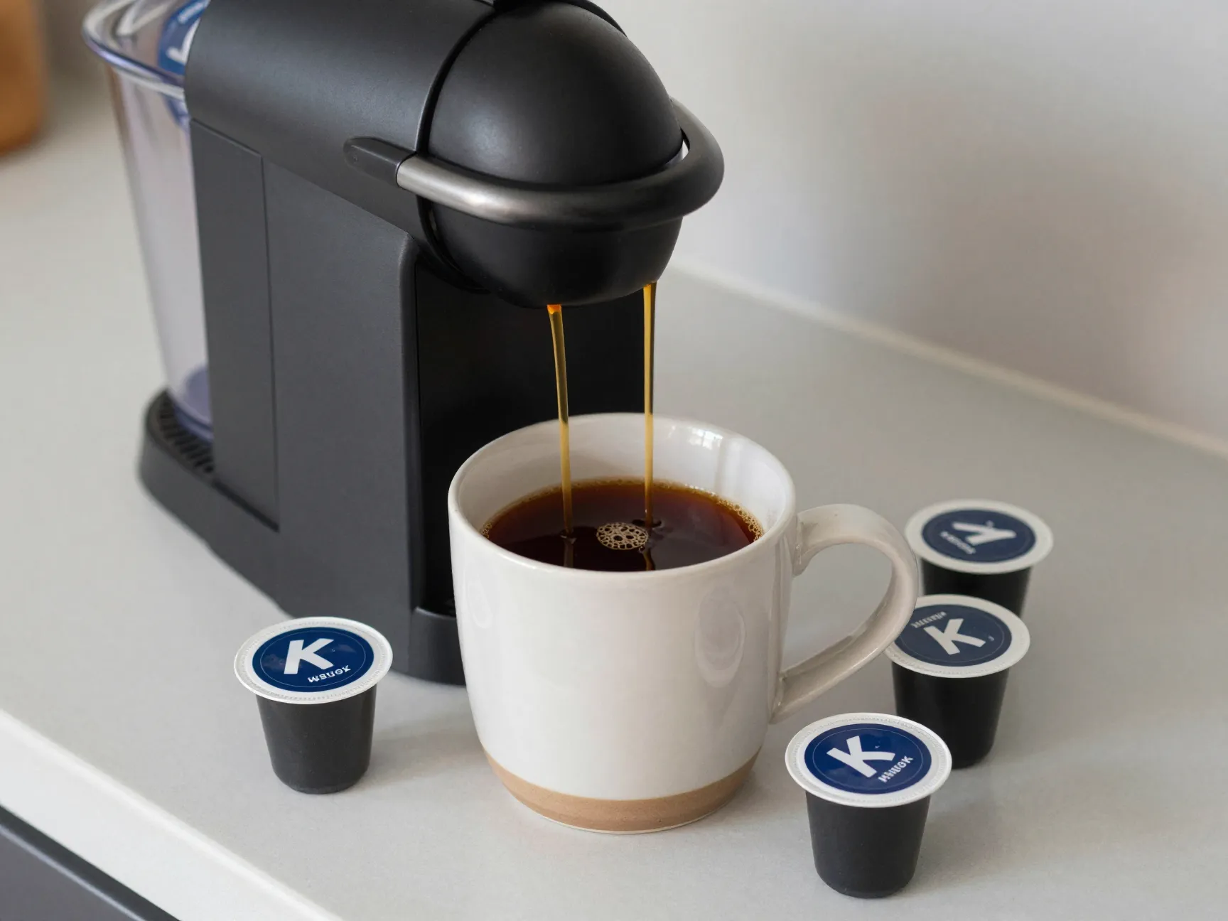 Two keurig pods brewing coffee into same large mug