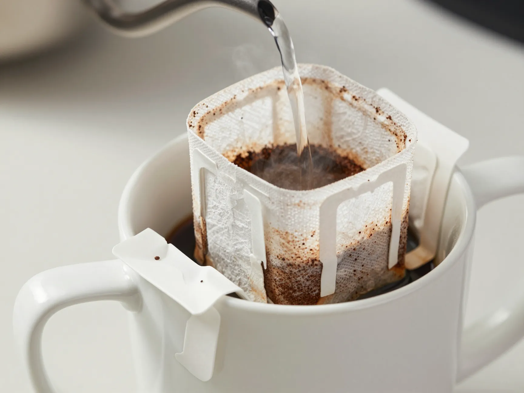 Paper towel pour over method cone in mug bloom stage