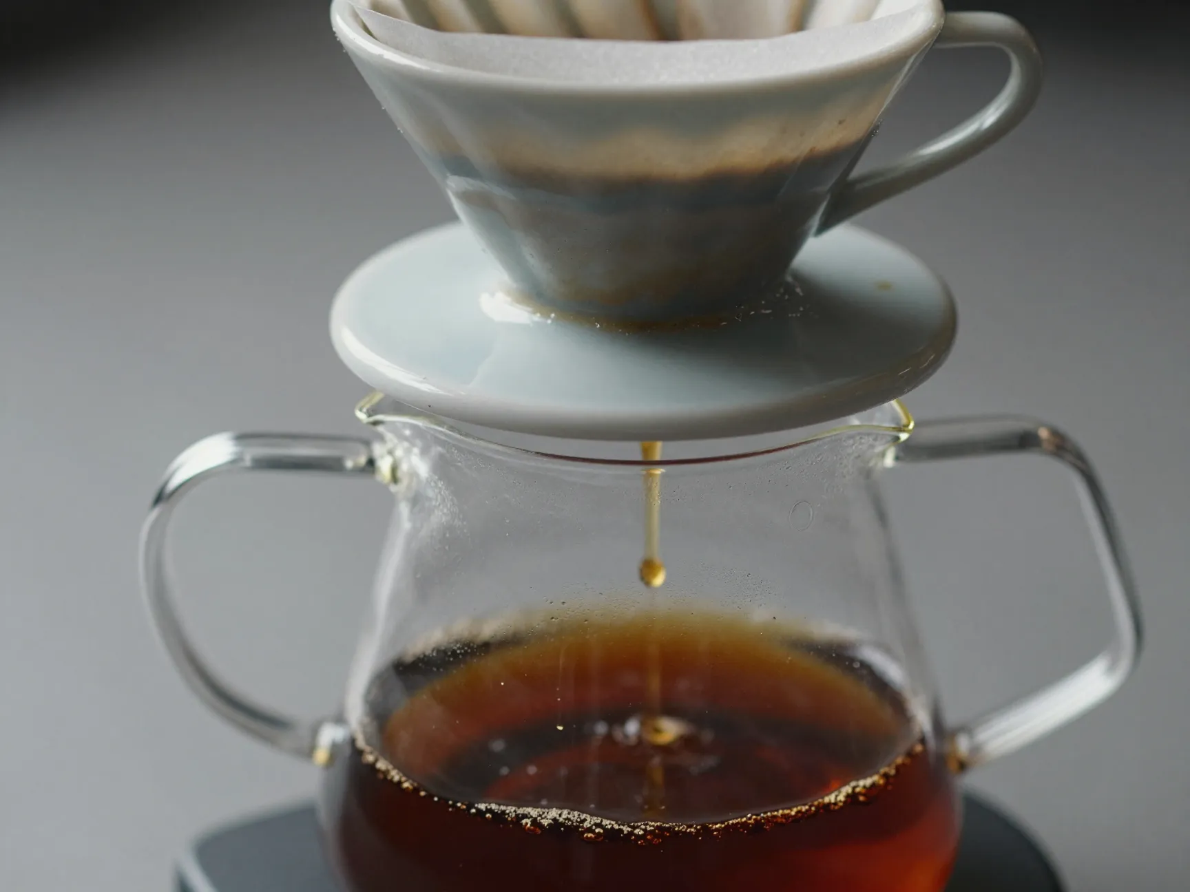 Rushing straining process gravity drip through paper filter undisturbed