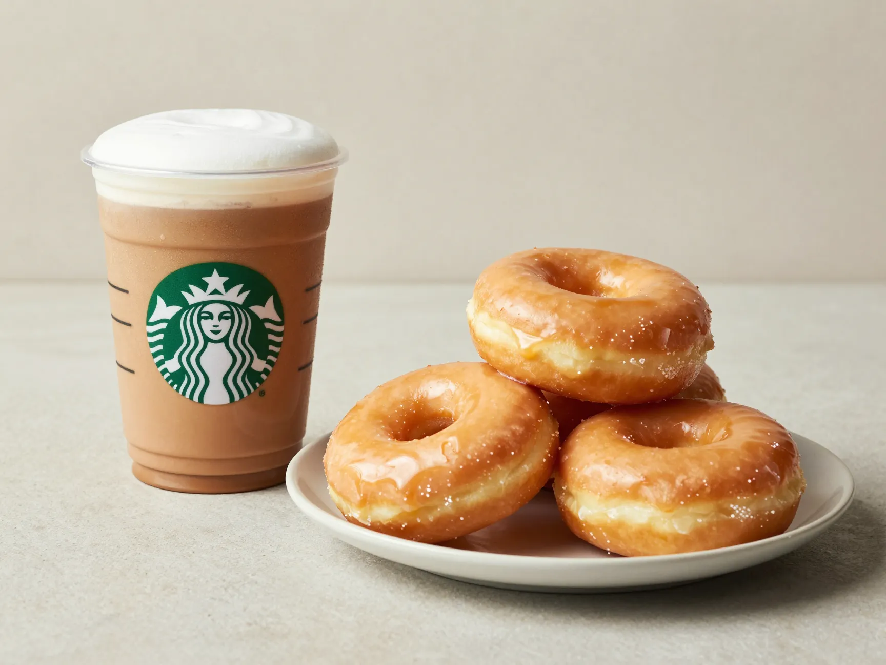 Grande caramel macchiato beside pile of four glazed donuts sugar equivalent