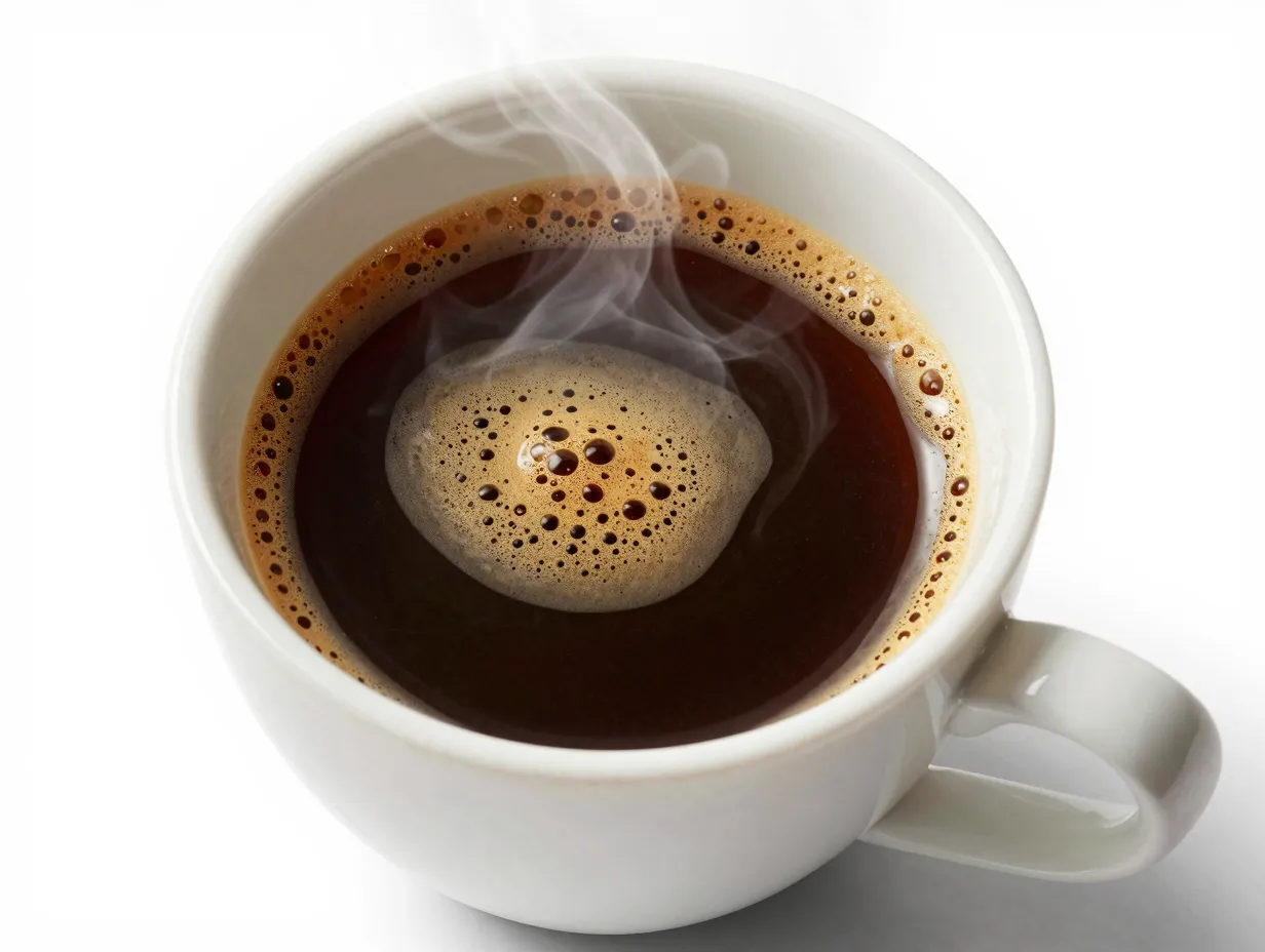 Clean black americano showcasing bold espresso roast in white cup