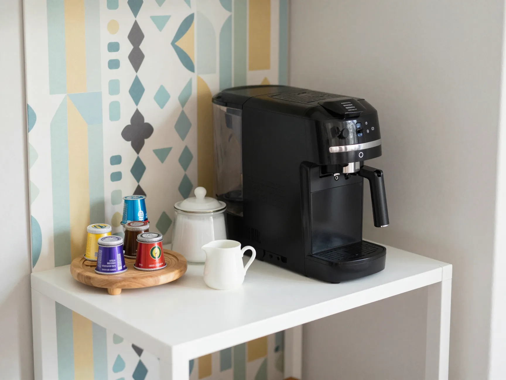 A compact coffee maker on a l shaped corner shelf with a lazy susan