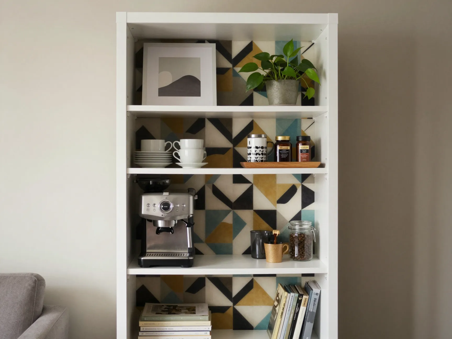 A tall white bookshelf dedicated as a coffee bar with patterned backing