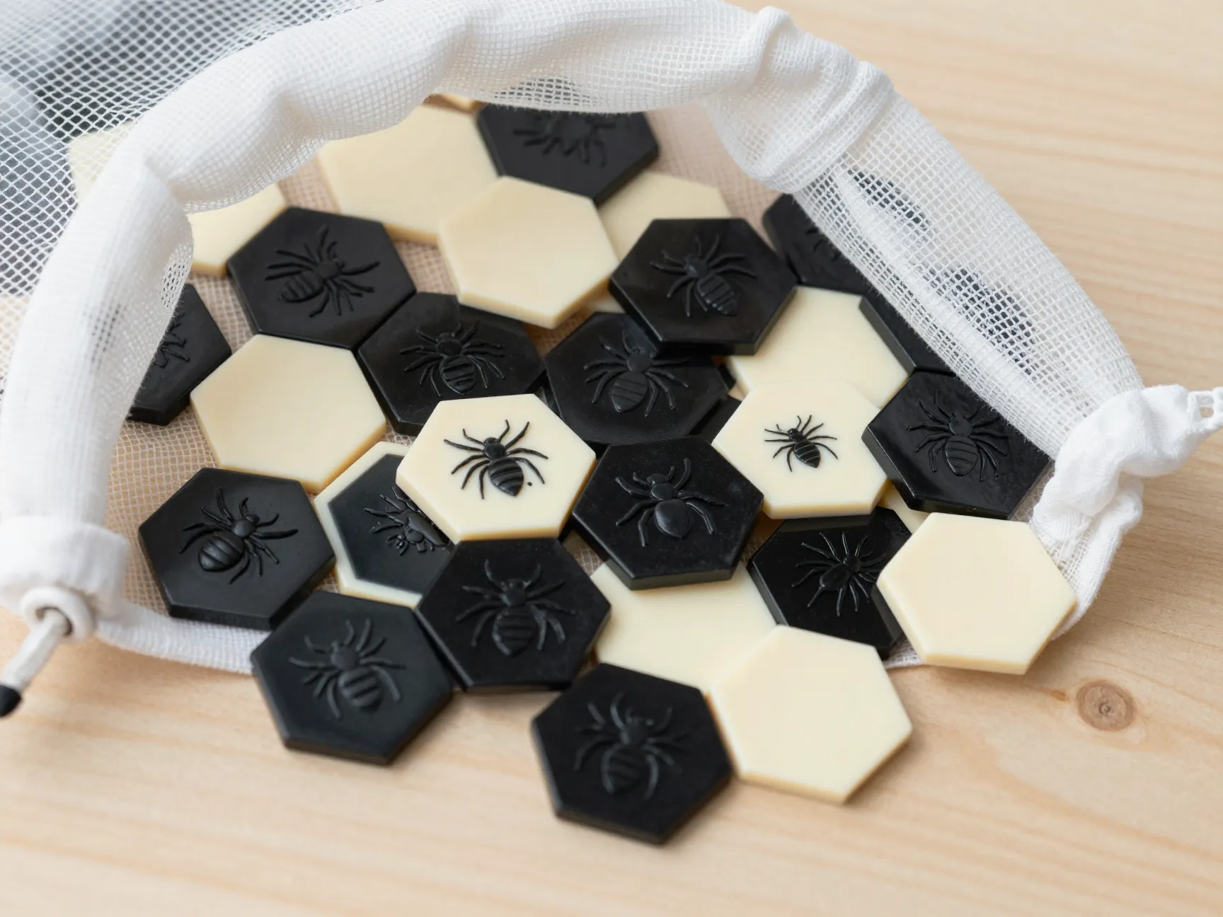 Hive pocket bakelite insect tiles on a mesh bag surface