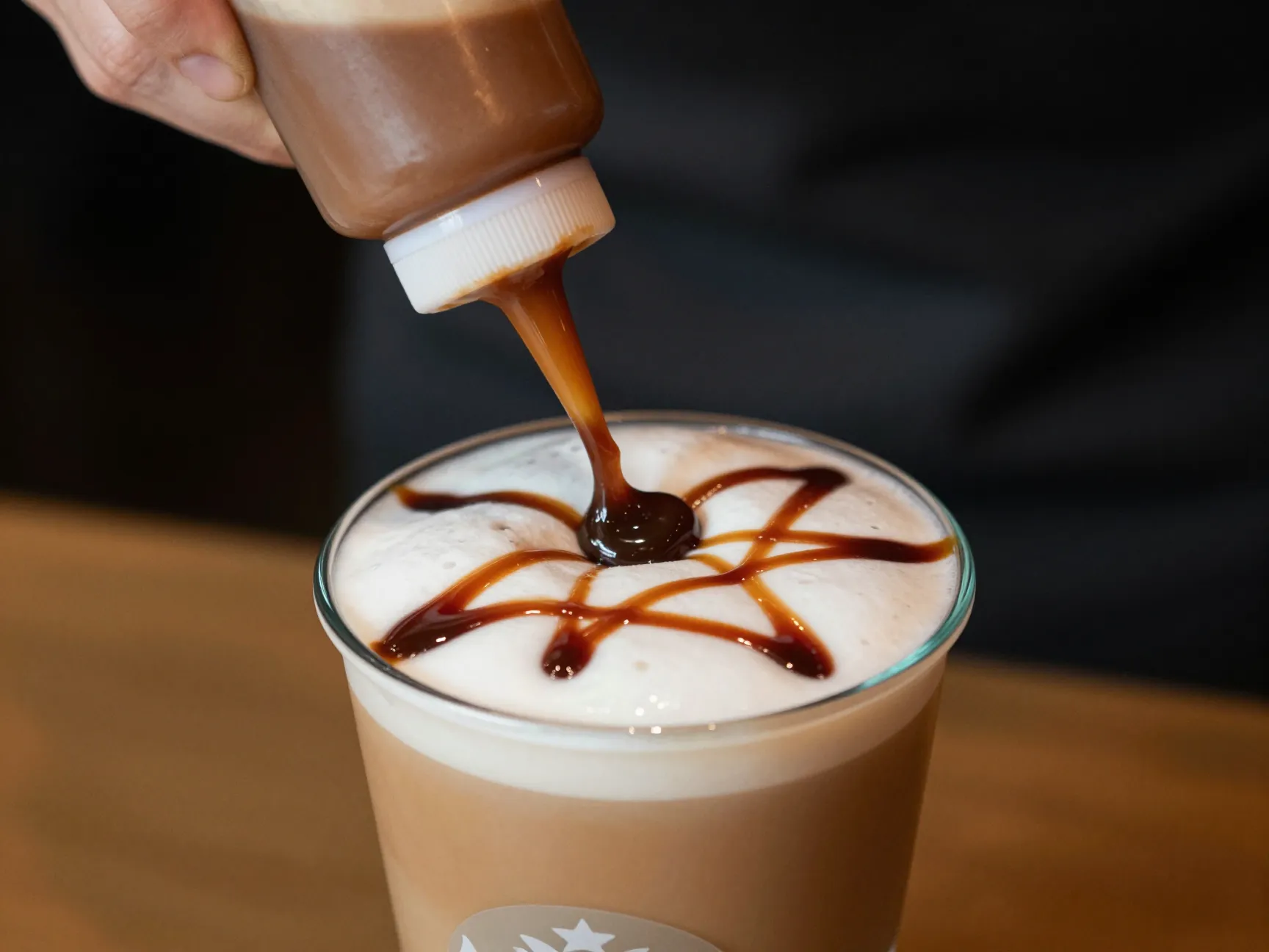 Mocha sauce drizzle replacing caramel on top of iced macchiato