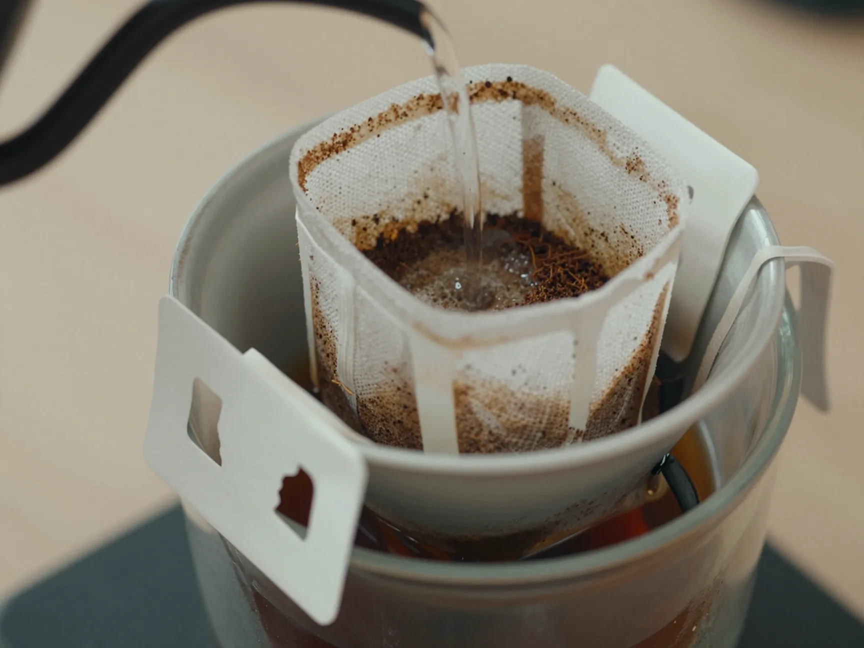 Improvised pour over with bandana filter blooming coffee