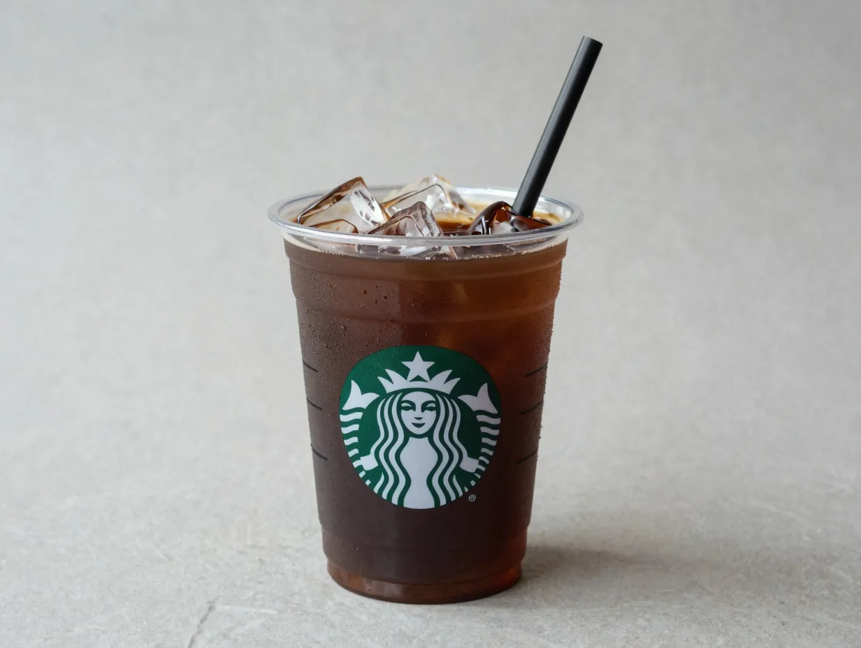 Starbucks unsweetened iced coffee with ice cubes in a cup
