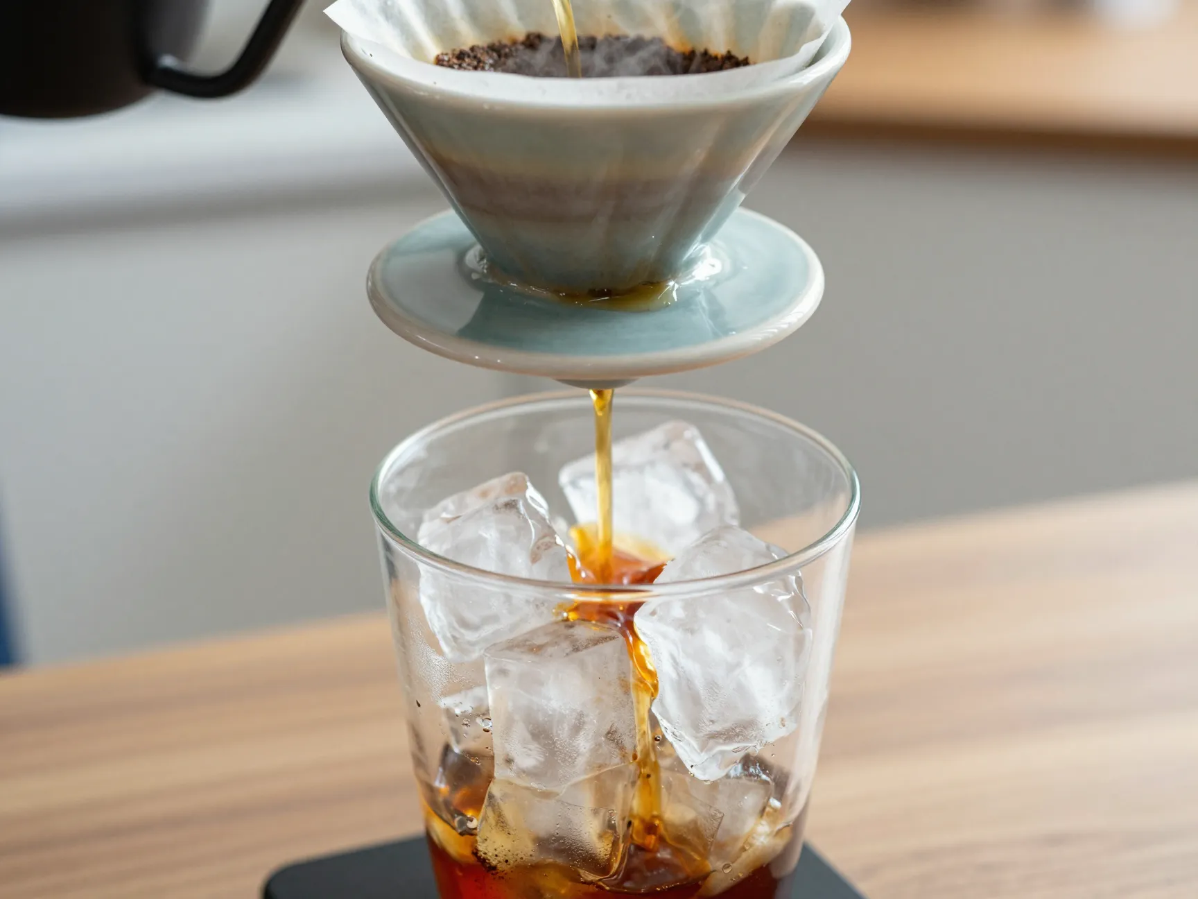 Japanese flash brew pour over coffee drips directly onto ice
