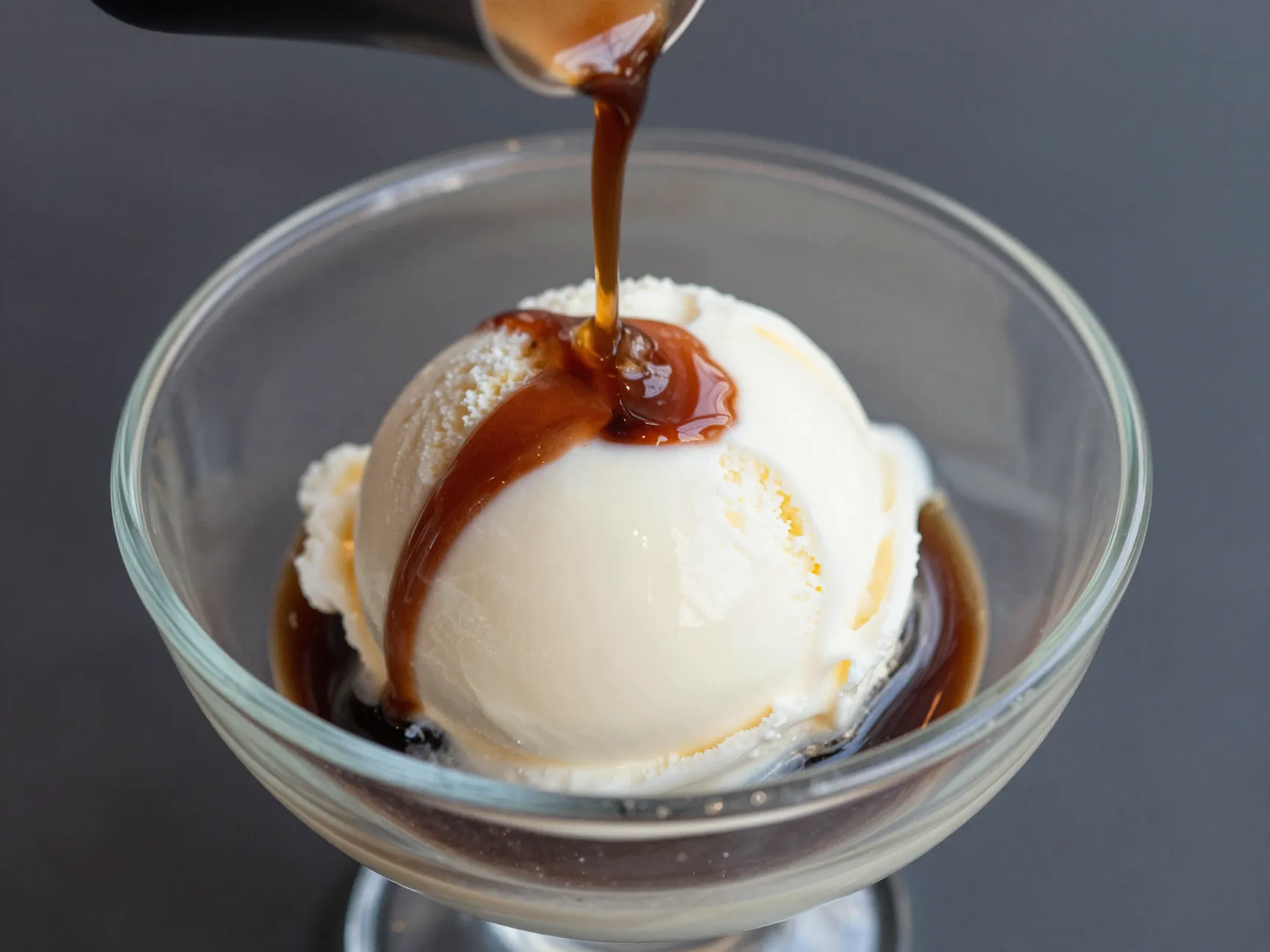 Affogato dessert with vanilla gelato and hot espresso