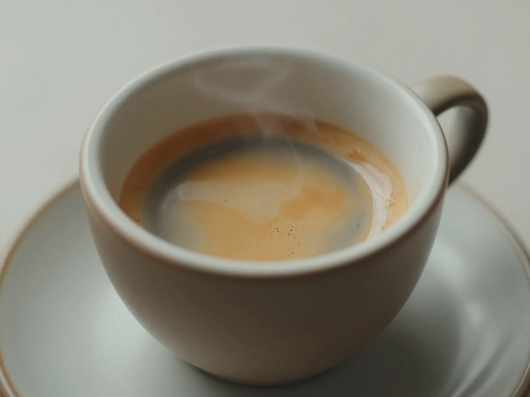 A shot of espresso resting in a cup for forty seconds