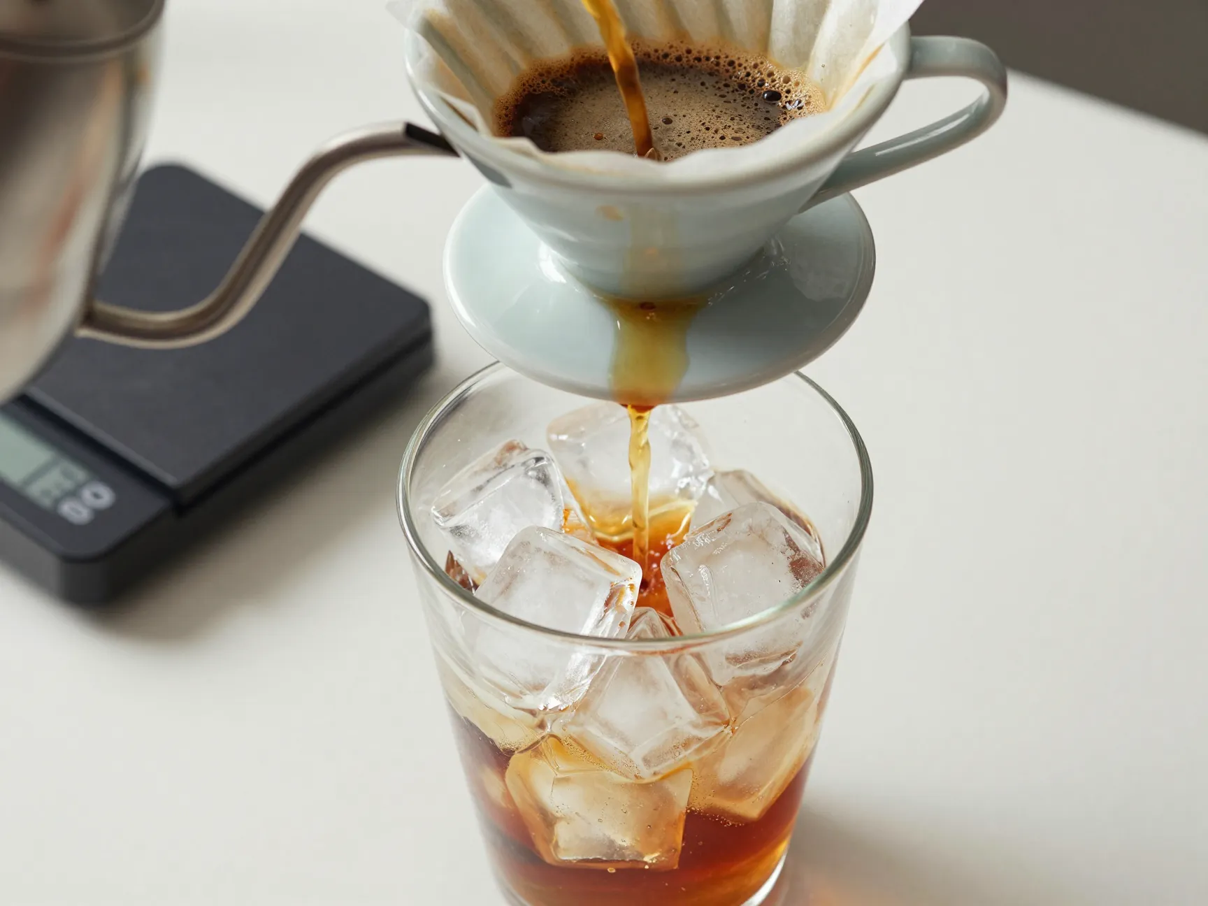 Flash brew pour over coffee directly onto a glass of ice