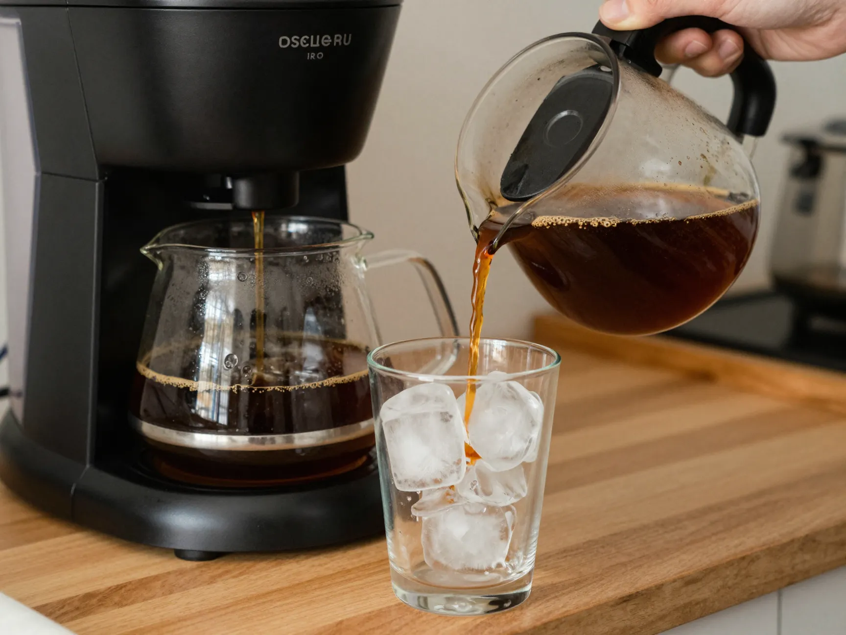 Double strength drip coffee machine brewing over ice