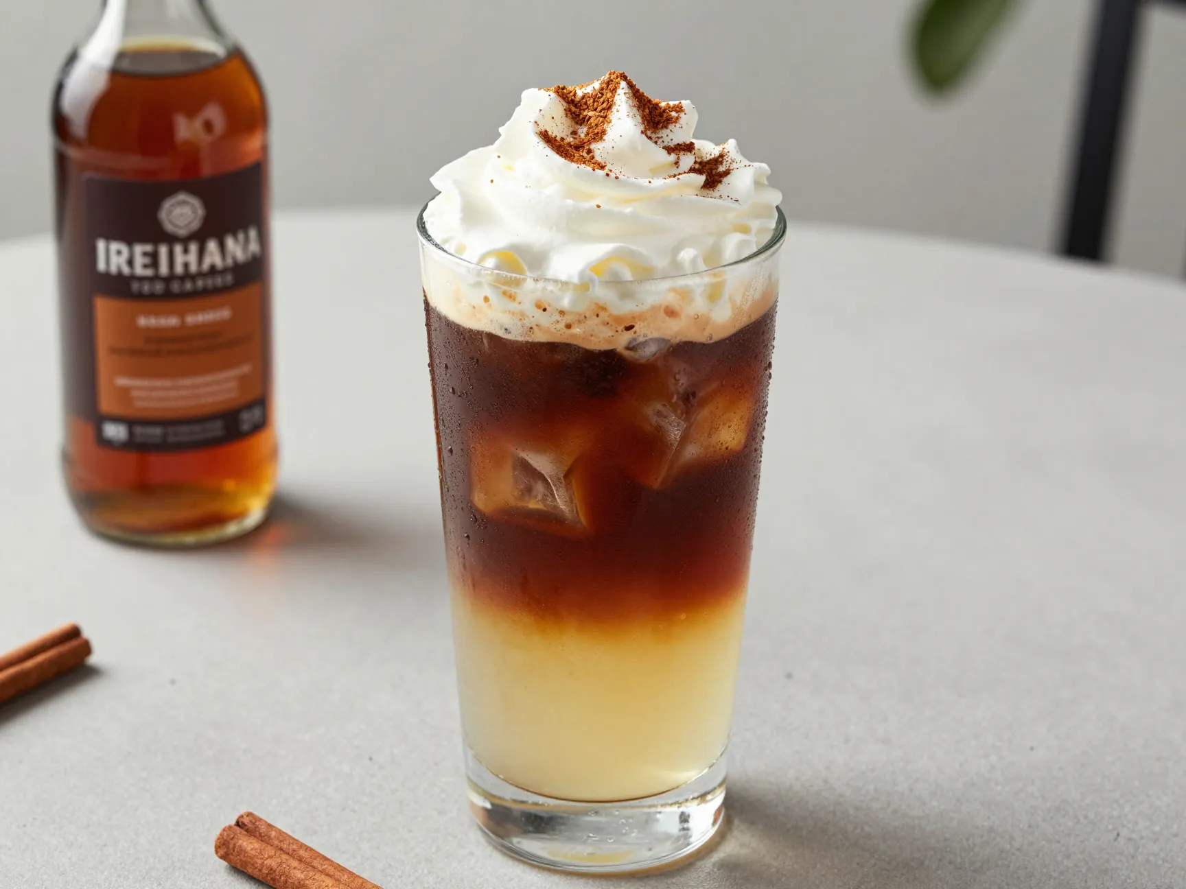Iced irish coffee with cold brew whiskey cinnamon syrup and nutmeg