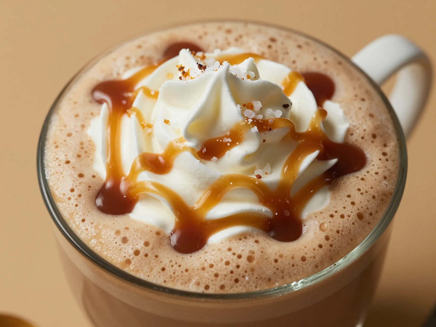 Caramel mocha latte topped with caramel drizzle sea salt flakes
