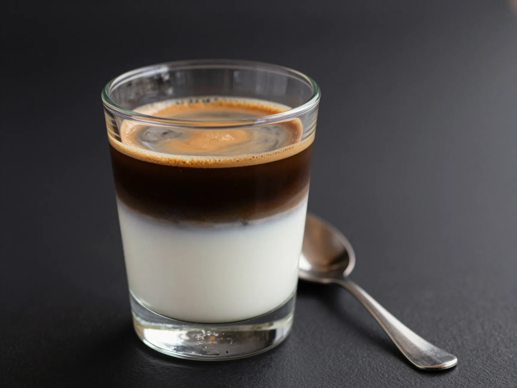 Cafe bombon espresso layered over condensed milk