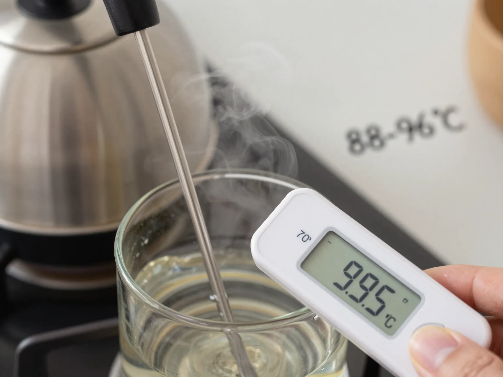 Digital thermometer showing ideal water temperature for americano