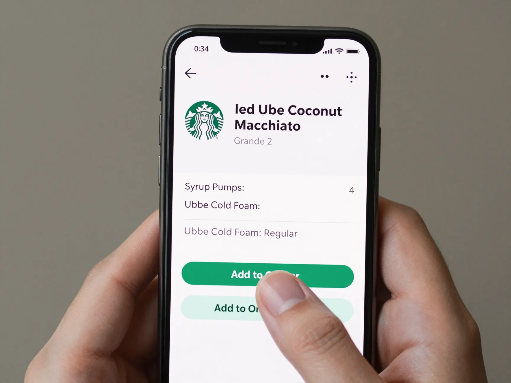 Customer ordering iced ube macchiato on starbucks mobile app