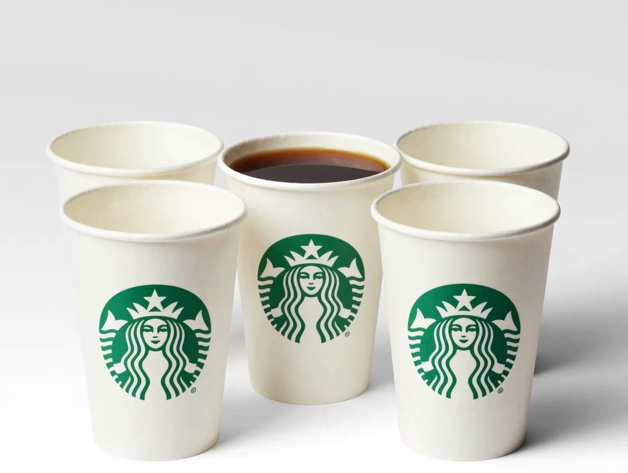 A grande paper cup americano with a second empty cup nested around it