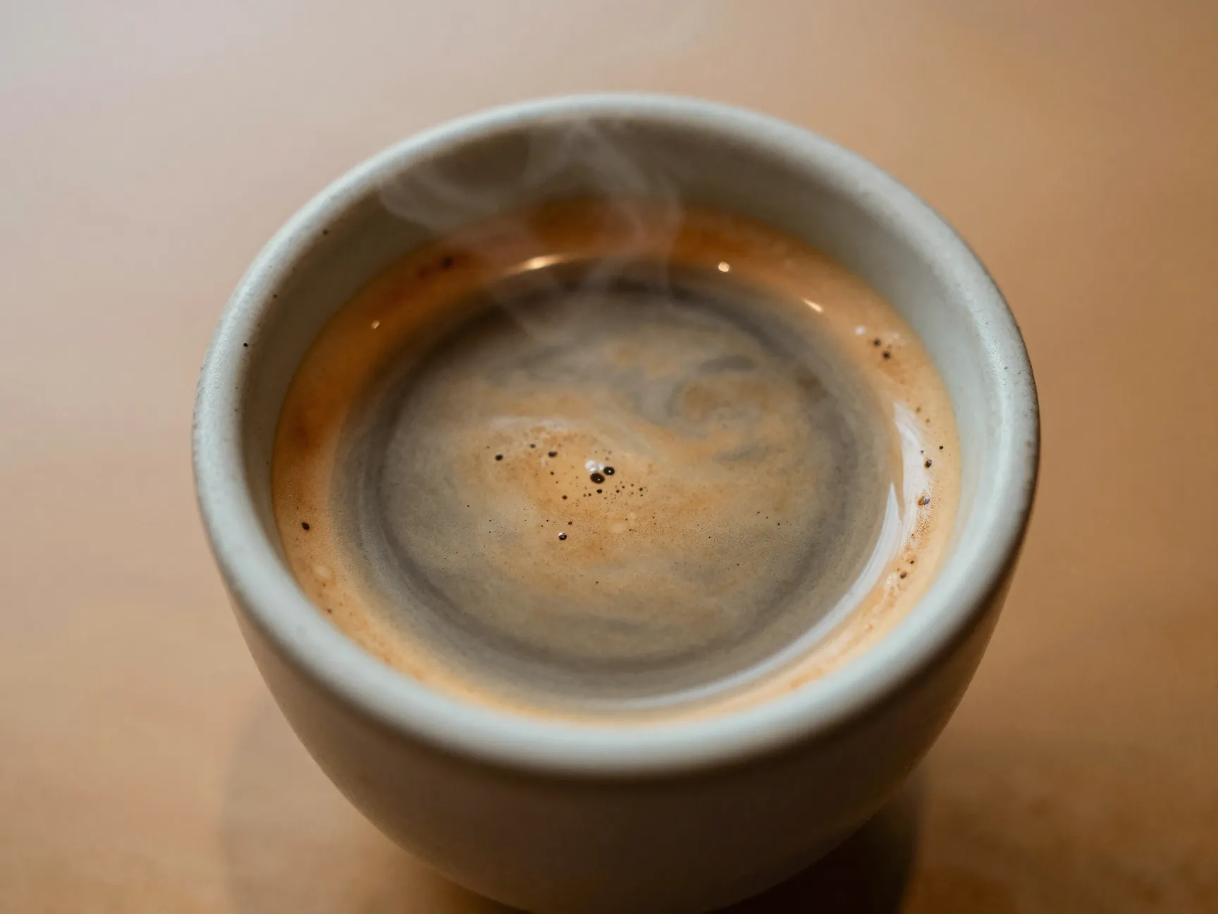 Bold espresso flavor dominates a small flat white cup